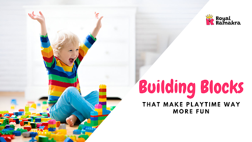 Happy child playing with colorful building blocks on the floor.