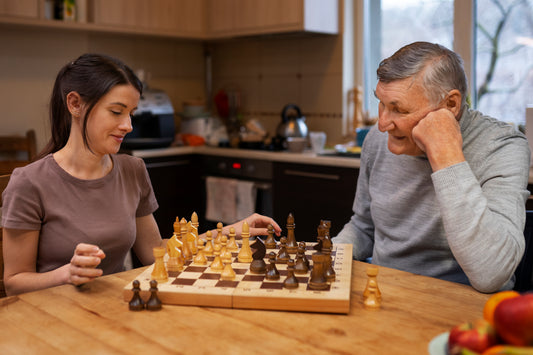 Ramakra | Female and old man playing indian board games