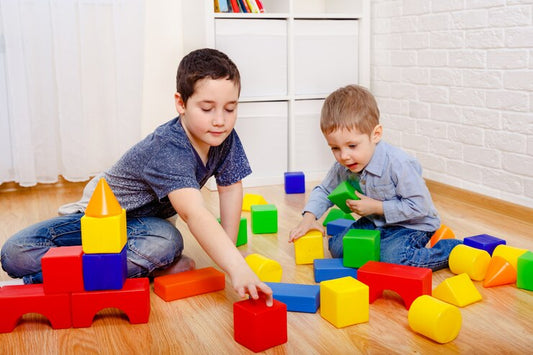 Ramakra | kid boys playing happily with building block toys